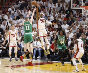 epa09954147 Miami Heat forward Jimmy Butler (R) defends Boston Celtics guard Payton Pritchard (L) during the first half of Game 1 of the NBA Eastern Conference Finals series between the Miami Heat and the Boston Celtics at FTX Arena in Miami, Florida, USA, 17 May 2022.  EPA/RHONA WISE  SHUTTERSTOCK OUT