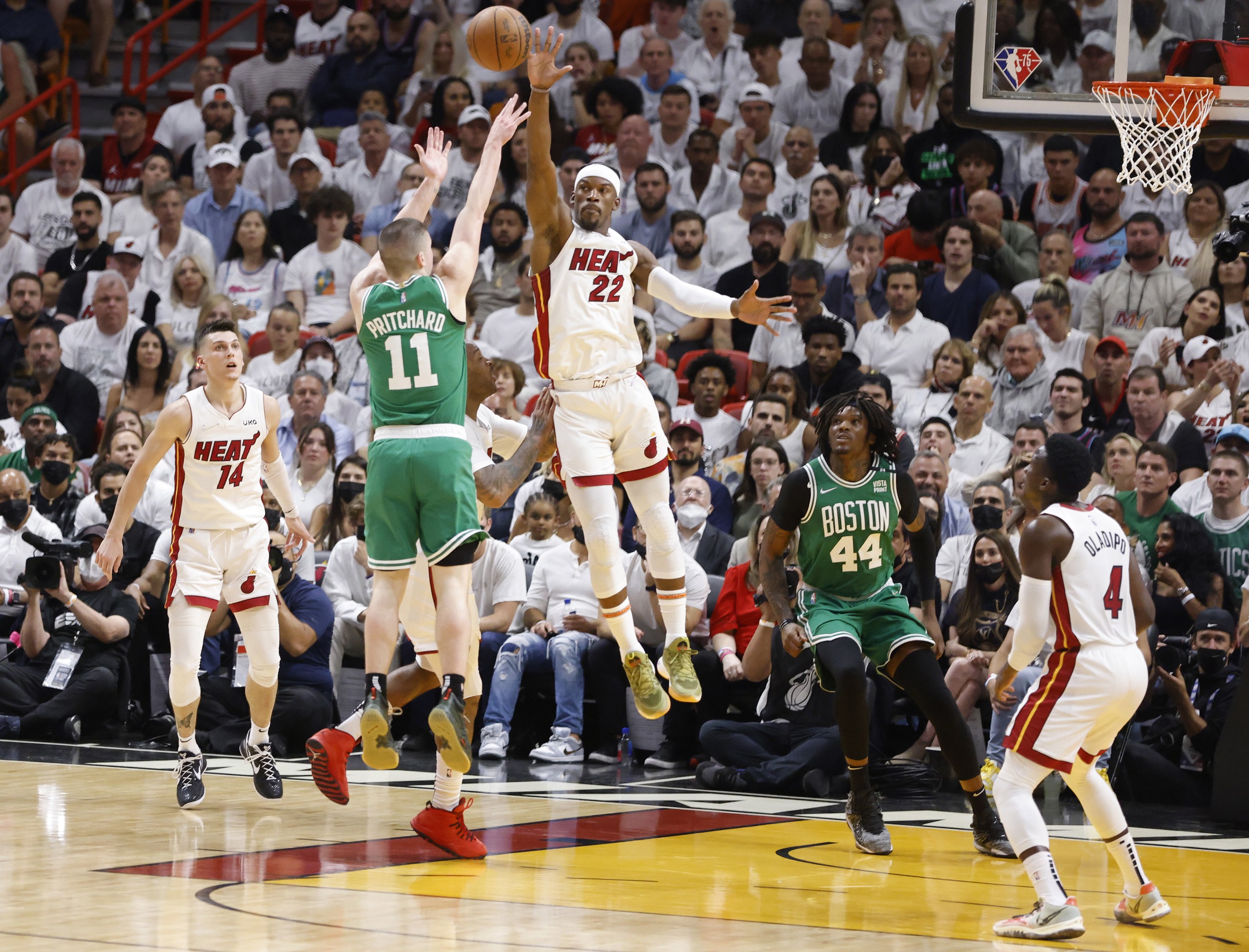 epa09954147 Miami Heat forward Jimmy Butler (R) defends Boston Celtics guard Payton Pritchard (L) during the first half of Game 1 of the NBA Eastern Conference Finals series between the Miami Heat and the Boston Celtics at FTX Arena in Miami, Florida, USA, 17 May 2022.  EPA/RHONA WISE  SHUTTERSTOCK OUT
