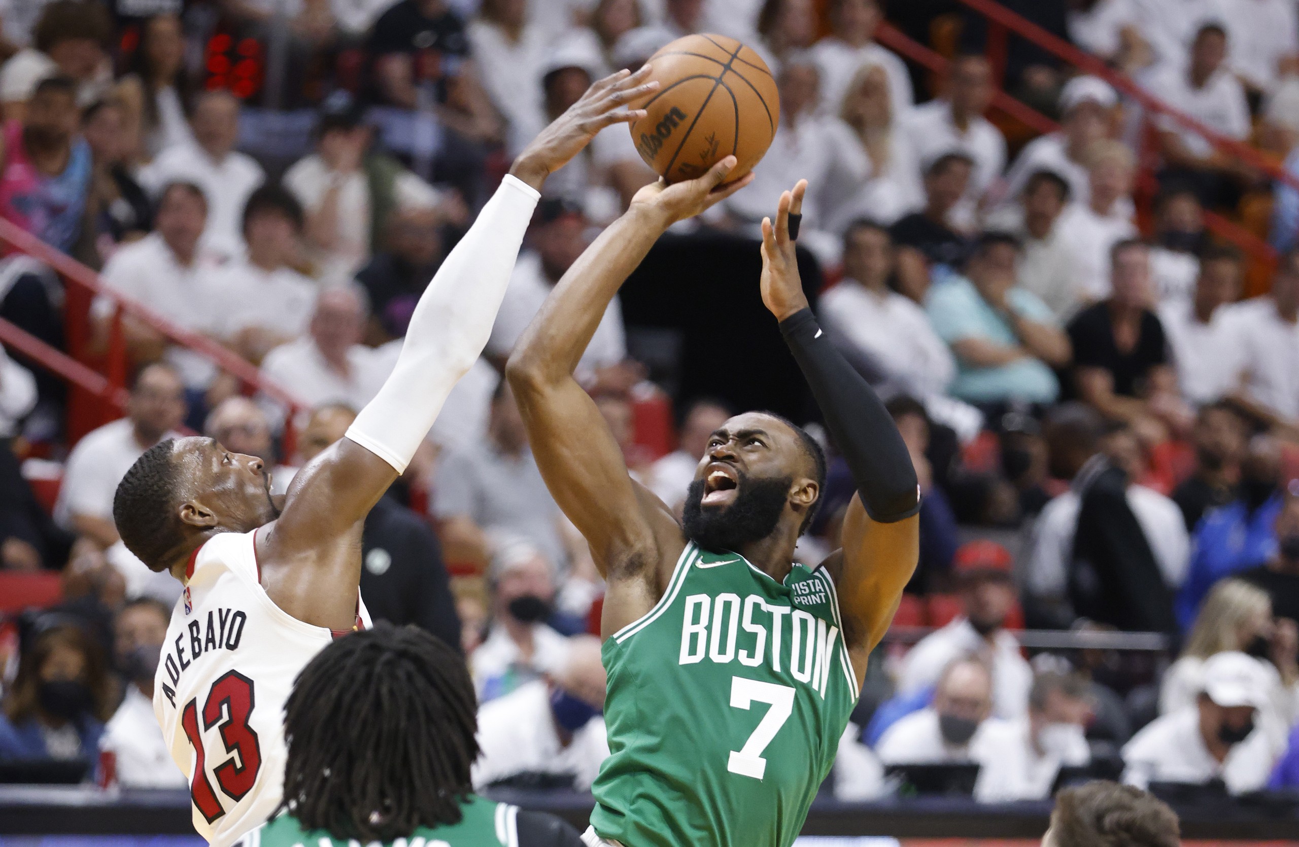 epa09954267 Miami Heat center Bam Adebayo (L) defends Boston Celtics forward Jalen Brown (R) during the second half of Game 1 of the NBA Eastern Conference Finals series between the Miami Heat and the Boston Celtics at FTX Arena in Miami, Florida, USA, 17 May 2022.  EPA/RHONA WISE  SHUTTERSTOCK OUT