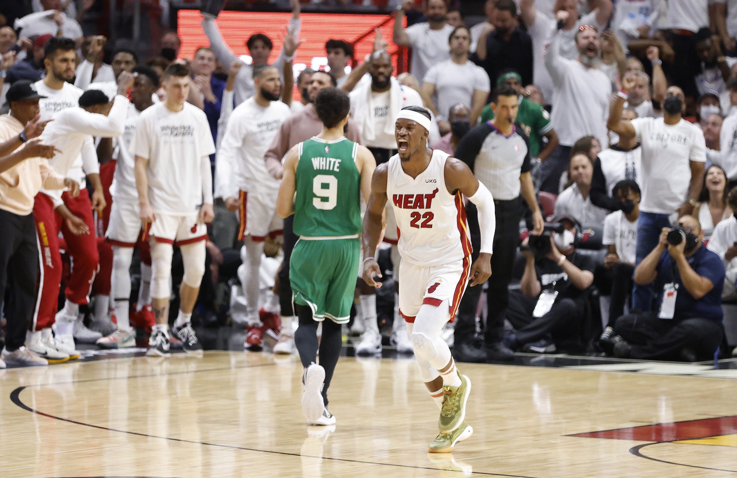 epa09954288 Miami Heat forward Jimmy Butler (R), reacts against the Boston Celtics during the second half of Game 1 of the NBA Eastern Conference Finals series between the Miami Heat and the Boston Celtics at FTX Arena in Miami, Florida, USA, 17 May 2022.  EPA/RHONA WISE  SHUTTERSTOCK OUT