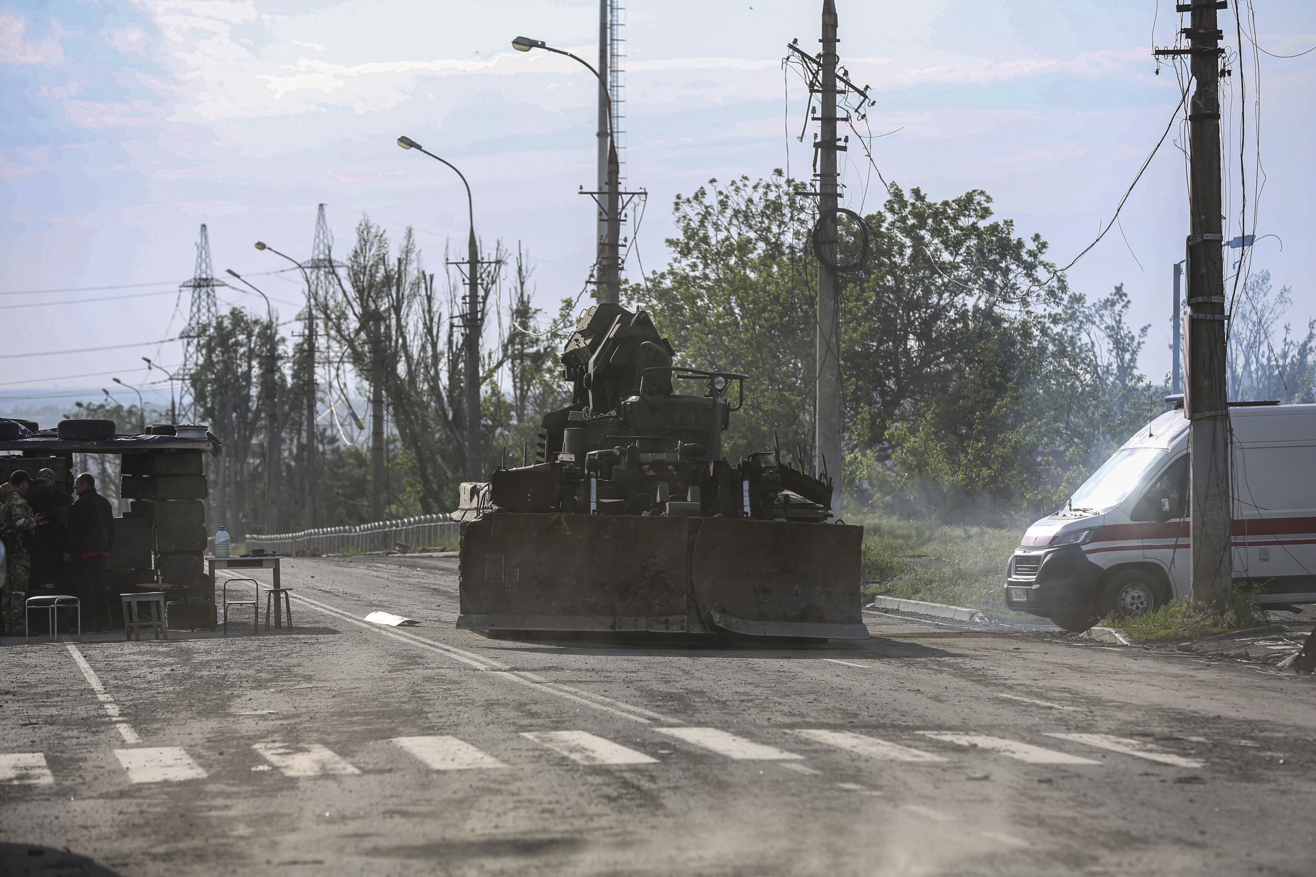 epa09965031 A Russian military vehicle moves towards the area surrounding the Azovstal steel plant to carry out a demining operation in Mariupol, Ukraine, 21 May 2022 (issued 22 May 2022). The Chief spokesman of the Russian Defense Ministry, Major General Igor Konashenkov, said on 20 May that the long-besieged Azovstal steel plant in Mariupol was under full Russian army control.  EPA/ALESSANDRO GUERRA
