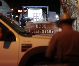 epaselect epa09973536 Police and investigators continue to work at the scene of a mass shooting at the Robb Elementary School in Uvalde, Texas, USA, 24 May 2022. According to Texas Governor Greg Abbott, at least 18 children and two adults were killed in the shooting. The eighteen-year-old gunman was killed by responding officers.  EPA/AARON M. SPRECHER