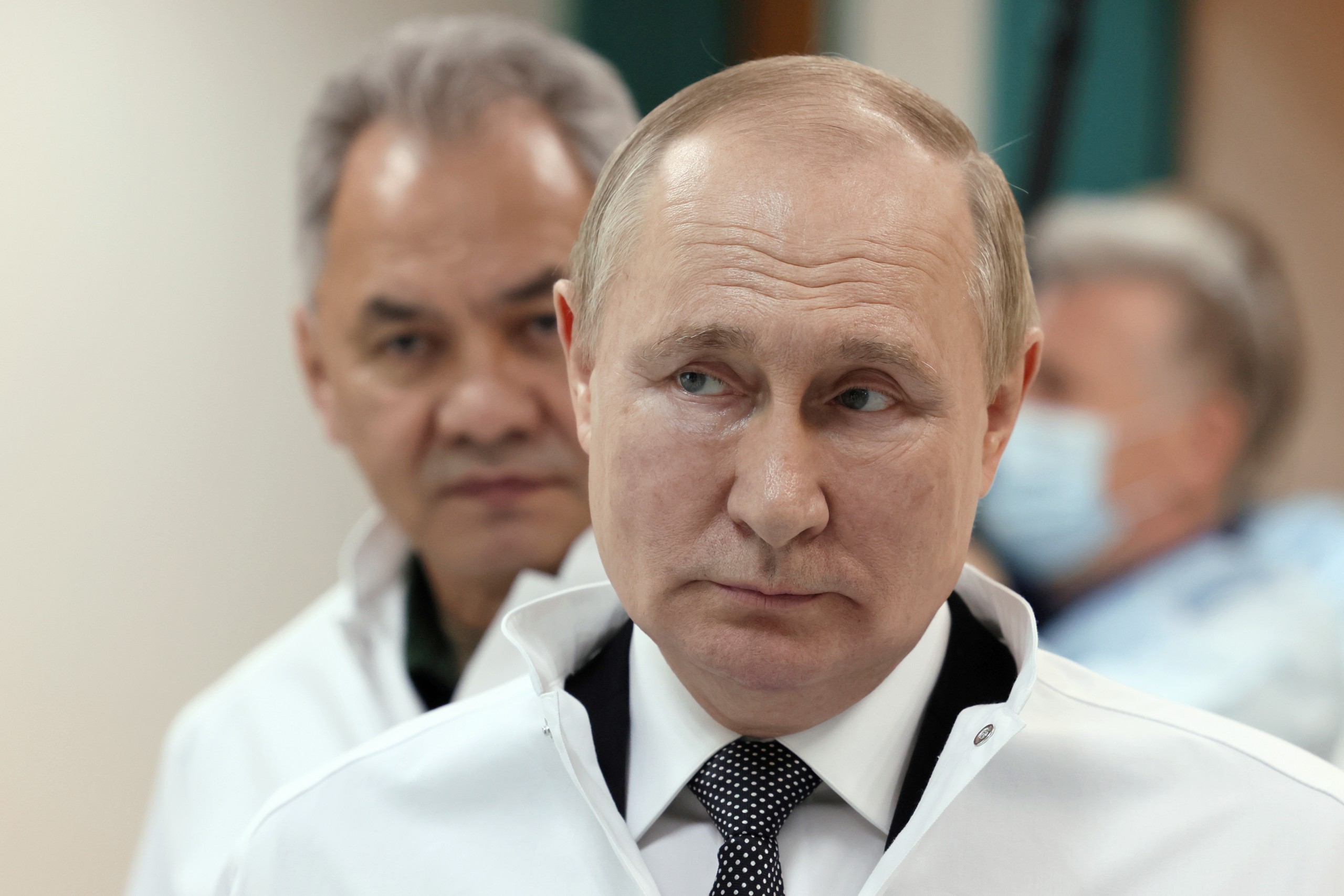 epa09975061 Russian President Vladimir Putin (front) and Russian Defence Minister Sergei Shoigu (back) visit the Central Military Clinical Hospital named after P.V. Mandryk where servicemen wounded during the Russian 'special military operation' in Ukraine are treated, in Moscow, Russia, 25 May 2022. On 24 February, Russian troops entered Ukrainian territory in what the Russian president declared a 'special military operation', resulting in fighting and destruction in the country, a huge flow of refugees, and multiple sanctions against Russia.  EPA/MIKHAIL METZEL / KREMLIN POOL / SPUTNIK / POOL MANDATORY CREDIT