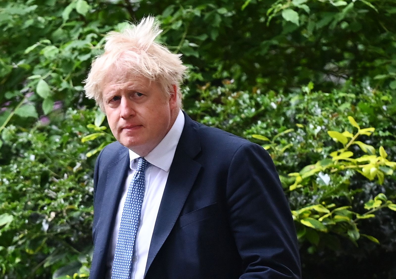 epa09974897 British Prime Minister Boris Johnson following a press conference at 10 Downing Street in London, Britain, 25 May 2022. Johnson is under pressure over 'party gate' allegations following new photographs showing him at a drinks party during lockdown.  EPA/ANDY RAIN