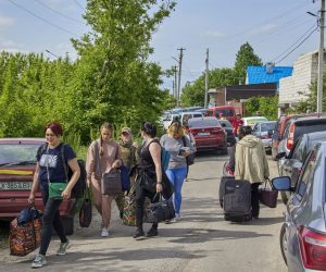 epa09987320 Ukrainian refugees arrive at a reception center in Chuhuiv, near Kharkiv, Ukraine, 30 May 2022 (issued 31 May 2022). More than one thousand civilians were evacuated from both occupied and frontline territories. Russian troops entered Ukraine on 24 February, starting a conflict that has wrought havoc and triggered a humanitarian crisis. According to data released by the United Nations refugee agency UNHCR on 29 May, over 6.8 million people have fled Ukraine since Russian troops entered the country on 24 February 2022.  EPA/SERGEY KOZLOV