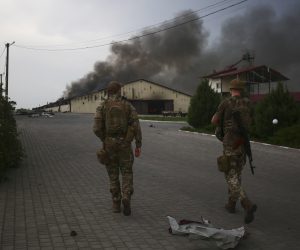 epa09988725 Ukrainian servicemen patrol the territory close to a front line near the small city of Bakhmut, Donetsk region, Ukraine, 31 May 2022. Russian troops entered Ukraine on 24 February resulting in fighting and destruction in the country and triggering a series of severe economic sanctions on Russia by Western countries.  EPA/STR