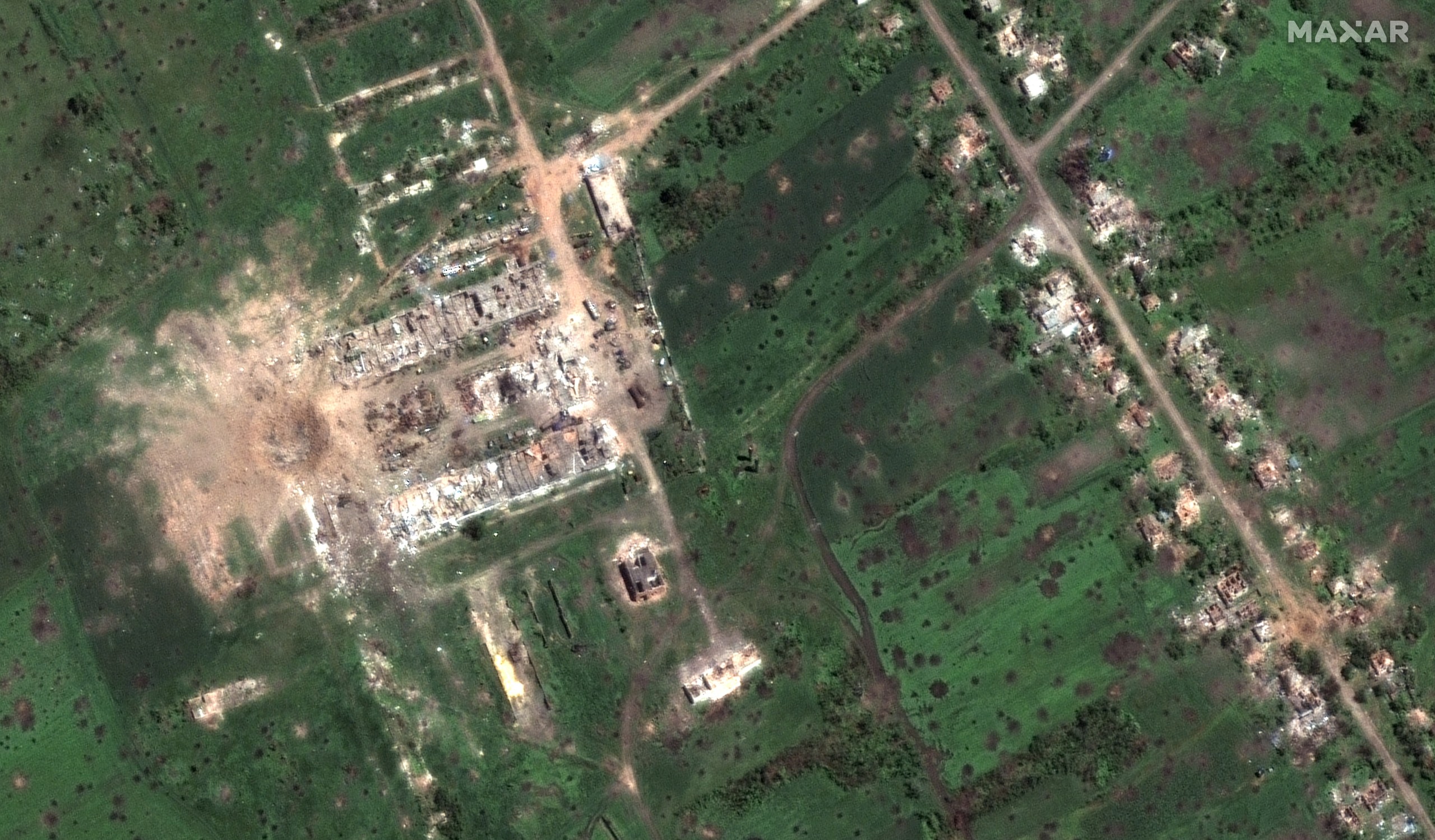 epa10000648 A handout satellite image made available by Maxar Technologies shows 40-meter diameter bomb crater and recent shelling with destroyed buildings in Dovhenke, Ukraine, 06 June 2022 (issued 07 June 2022). Maxar collected new satellite imagery that claims to show nearly continuous and relentless bombardment and artillery shelling of villages and cities in eastern Ukraine as Russian forces attempt to gain control of the Luhansk and Donetsk Oblasts. On 24 February, Russian troops invaded Ukrainian territory starting a conflict that has provoked destruction and a humanitarian crisis. According to the UNHCR, more than 6.9 million refugees have fled Ukraine, and a further 7.7 million people have been displaced internally within Ukraine since.  EPA/MAXAR TECHNOLOGIES HANDOUT -- MANDATORY CREDIT: SATELLITE IMAGE 2022 MAXAR TECHNOLOGIES -- THE WATERMARK MAY NOT BE REMOVED/CROPPED -- HANDOUT EDITORIAL USE ONLY/NO SALES