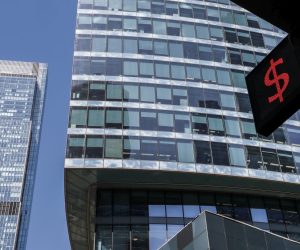 epa10002452 A panel displays the dollar sign at an exchange office in front of the towers the Moscow International Business Center in Moscow, Russia, 08 June 2022. The Moscow International Business Center is a major financial centre in Russia.  EPA/YURI KOCHETKOV