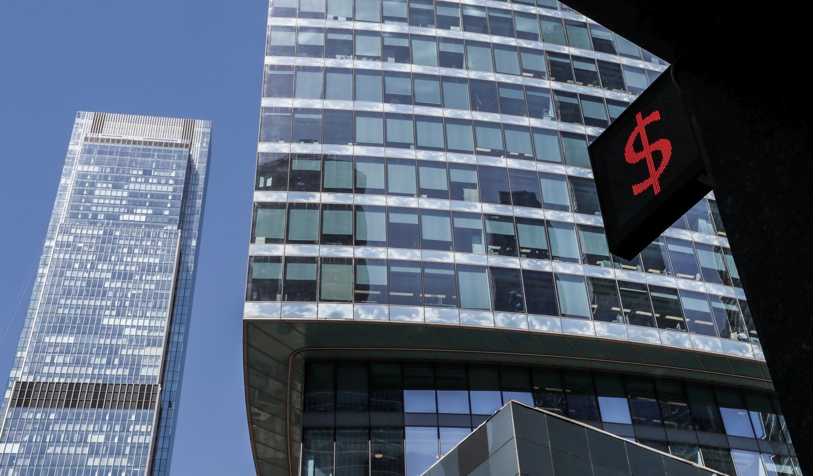 epa10002452 A panel displays the dollar sign at an exchange office in front of the towers the Moscow International Business Center in Moscow, Russia, 08 June 2022. The Moscow International Business Center is a major financial centre in Russia.  EPA/YURI KOCHETKOV