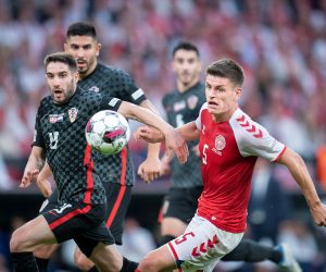 epa10006679 Denmark's Joakim Maehle (R) and Croatia's Luka Ivanusec in action during the UEFA Nations League soccer match between Denmark and Croatia in Copenhagen, Denmark, 10 June 2022.  EPA/Liselotte Sabroe  DENMARK OUT