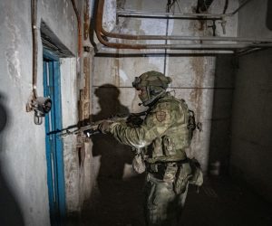 epa10011103 A picture taken during a visit to Mariupol organized by the Russian military shows an armed Russian serviceman inspecting the undergrounds of the Azovstal steel plant in Mariupol, eastern Ukraine, 13 June 2022. According to a statement by the Ukrainian Presidential Office on 06 June quoting President Zelensky, there may be more than 2,500 prisoners from the Azovstal plant being held captive by Russian forces. On 24 February Russian troops had entered Ukrainian territory in what the Russian president declared a 'special military operation', resulting in fighting, and multiple sanctions against Russia.  EPA/SERGEI ILNITSKY