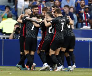 epa10011387 Players of Croatia celebrate after Luka Modric of Croatia scored the 1-0 by penalty during the UEFA Nations League soccer match between France and Croatia in Saint-Denis, near Paris, France, 13 June 2022.  EPA/Mohammed Badra