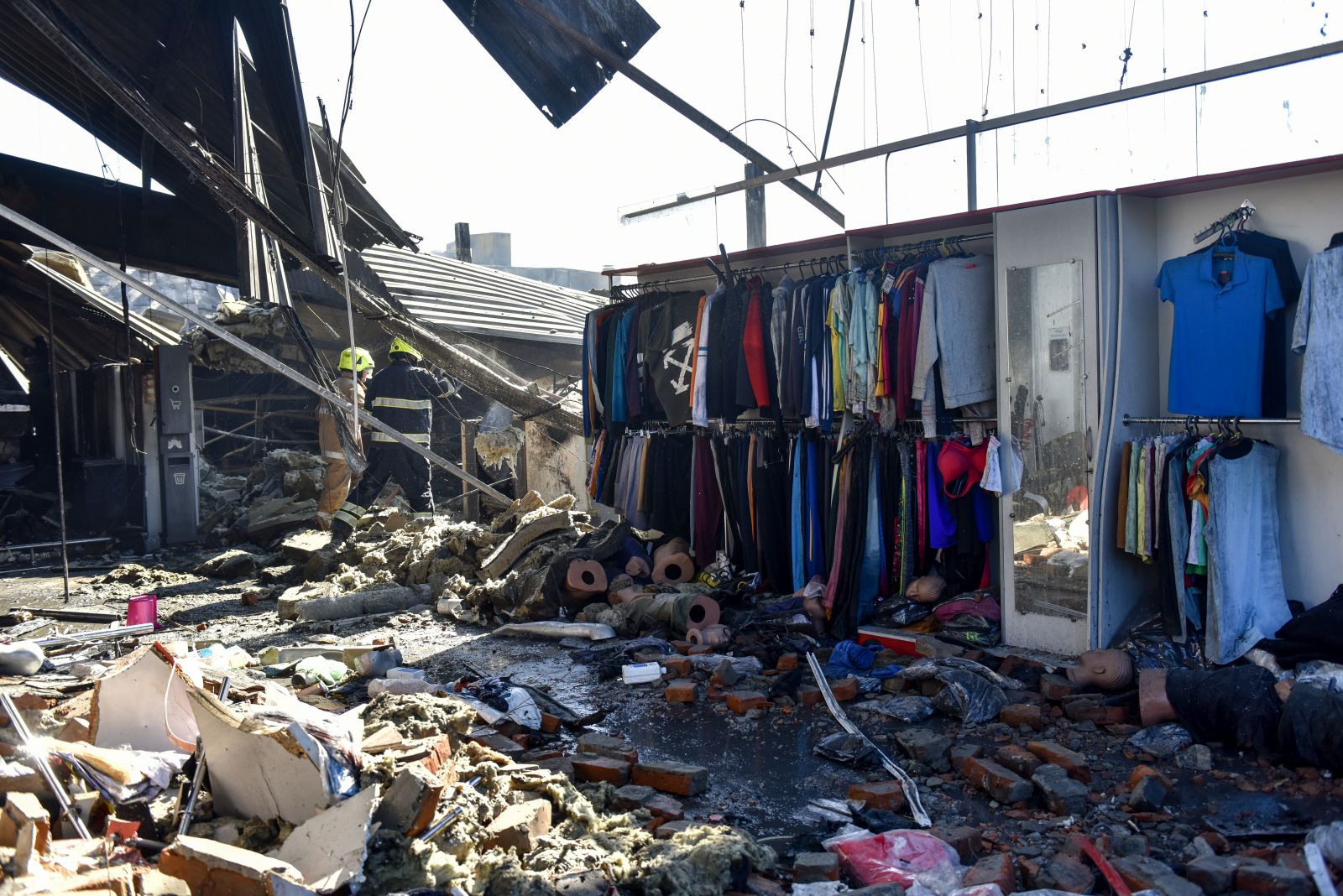 epa10037752 Remains of the destroyed Amstor shopping mall in Kremenchuk, Poltava Oblast, Ukraine, 28 June 2022. At least eighteen people died and at least 58 others were injured following Russian airstrikes on the crowded shopping mall, the State Emergency Service (SES) of Ukraine said in a Telegram post. The one-story building of a shopping center was hit by Russian rockets in the afternoon.  EPA/OLEG PETRASYUK