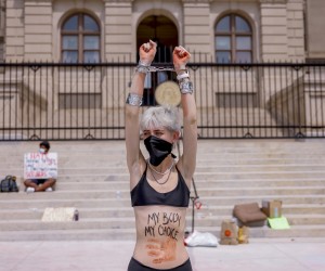 epa10038931 A woman joins a small group of pro-abortion demonstrators continue to protest outside the Georgia State Capitol after the US Supreme Court’s decision on the Dobbs v Jackson Women's Health Organization ruling in Atlanta, Georgia, USA, 28 June 2022. The court’s ruling overturned the legalization of abortion in the Roe v Wade case of 1973. Georgia’s 'Heartbeat' bill signed in 2019 has been blocked from taking effect due to a lawsuit being heard by the US 11th Circuit Court of Appeals.  EPA/ERIK S. LESSER