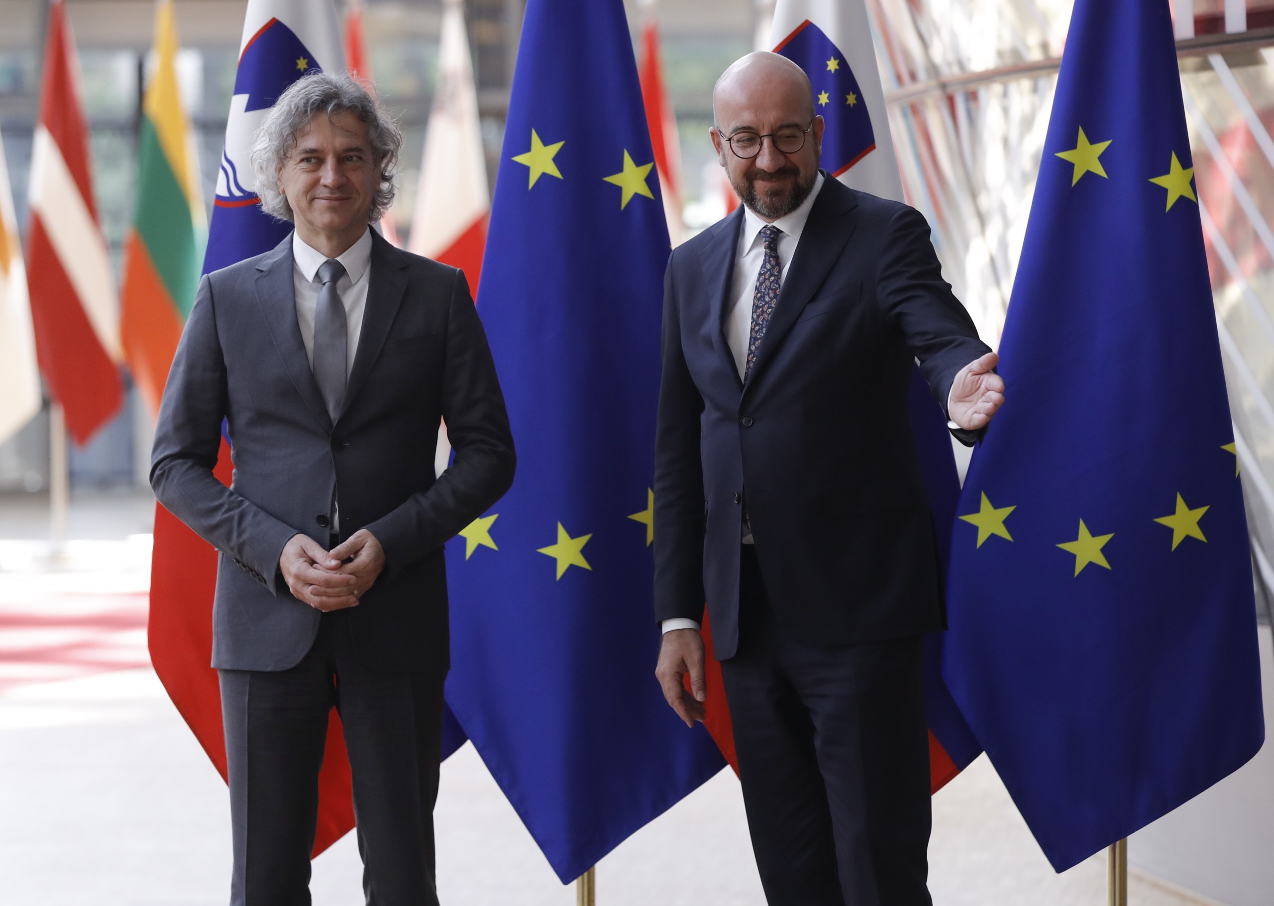 epa10017683  European Council President Charles Michel (R) welcomes the Prime Minister of Slovenia Robert Golob (L) ahead of a meeting at the European council in Brussels, Belgium, 17 June 2022.  EPA/OLIVIER HOSLET