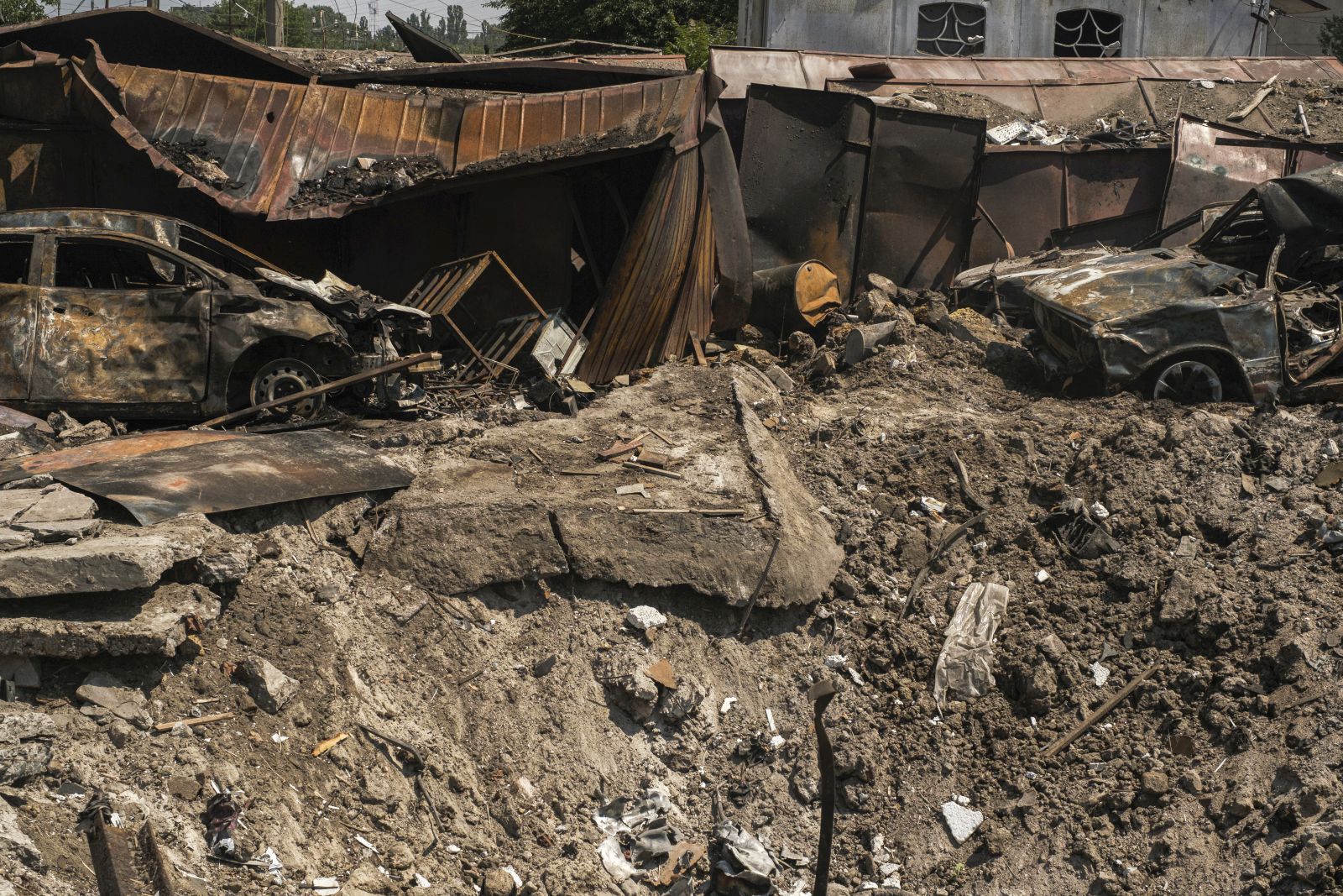 epa10041007 Debris of destroyed private garages after shelling at a residential area in Mykolaiv, southern Ukraine, 29 June 2022. The Head of the Mykolaiv Regional Military Administration, Vitaliy Kim, reported that as a result of shelling hitting a high-rise apartment building in Mykolaiv on 29 June 2022, at least three people died and five others were injured. Russian troops on 24 February entered Ukrainian territory, starting a conflict that has provoked destruction and a humanitarian crisis.  EPA/GEORGE IVANCHENKO