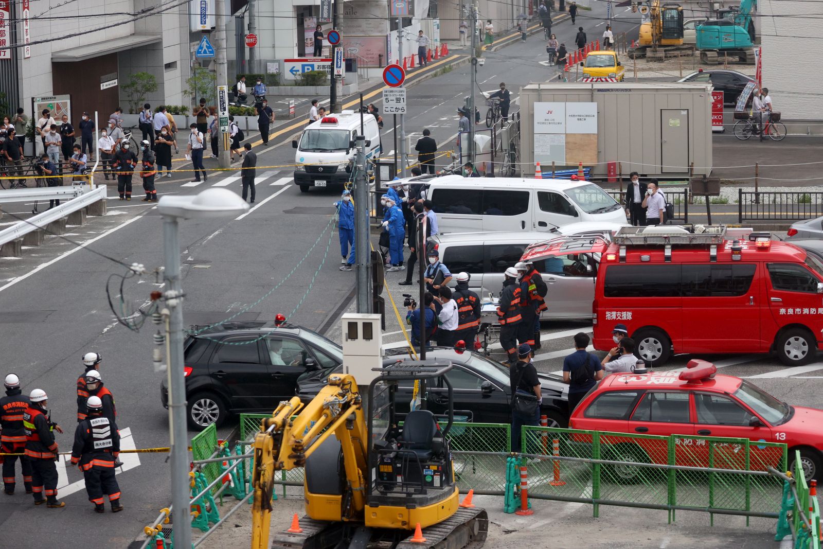 epaselect epa10058549 Police and firefighters gather around Yamato-Saidaiji Station of Kintetsu Railway in Nara, Japan, 08 July 2022, after Japan’s former Prime Minister Shinzo Abe was shot and gravely injured during an Upper House election campaign act to support a party candidate, according to local emergency authorities. The alleged shooter was taken into custody.  EPA/JIJI PRESS JAPAN OUT  EDITORIAL USE ONLY