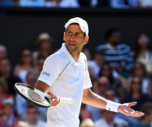 epa10059659 Novak Djokovic of Serbia reacts during his men's semi final match against Cameron Norrie of Britain at the Wimbledon Championships in Wimbledon, Britain, 08 July 2022.  EPA/NEIL HALL   EDITORIAL USE ONLY