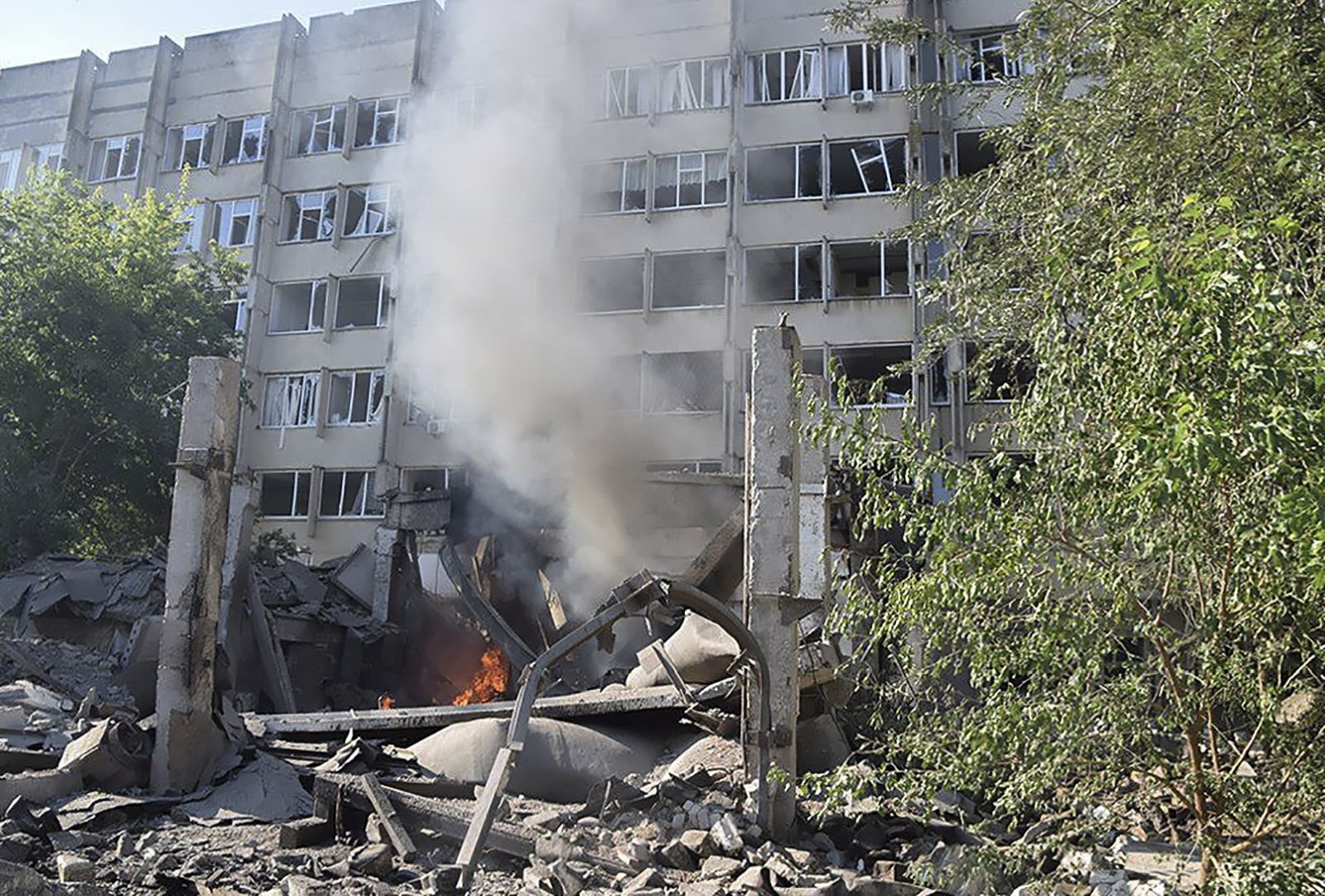 epa10076277 A handout photo made available by the press service of the State Emergency Service of Ukraine shows a damaged building after a shelling in Mykolaiv, Ukraine, 17 July 2022. According to Mykolaiv Regional State Administration head Vitaly Kim, Mykolaiv was under massive rocket fire in which two industrial enterprises caught fire.  EPA/UKRAINIAN STATE EMERGENCY SERVICE / HANDOUT  HANDOUT EDITORIAL USE ONLY/NO SALES