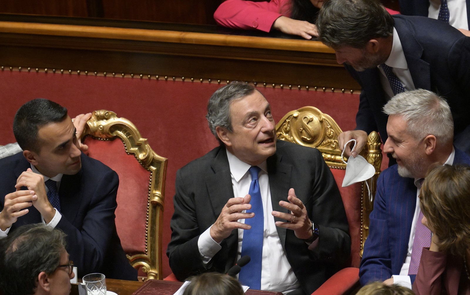 epa10082614 Italian Prime Minister Mario Draghi (C) flanked by ministers during the Senate confidence vote on Draghi's government, in Rome, Italy, 20 July 2022. On the day, Draghi told the Senate that the 'only way forward' for his executive is 'to reconstruct the pact of trust' that it was founded on as reported on the crisis of government. The previous week, Italian President Mattarella refused to accept Draghi's resignations following the failure of ruling coalition partner 5-Star Movement (M5S) to back the government in a confidence vote.  EPA/CLAUDIO PERI