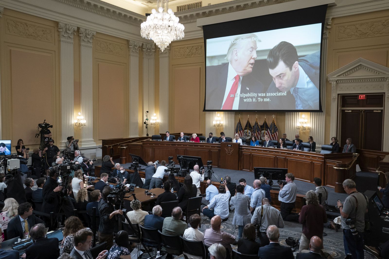 epa10085837 A video of a photograph of President Donald Trump (L), and aid Nick Luna, is shown on a screen,, as the House select committee investigating the January 6 attack on the US Capitol holds a hearing, at the Capitol, in Washington, DC, USA, 21 July 2022.  EPA/Alex Brandon / POOL