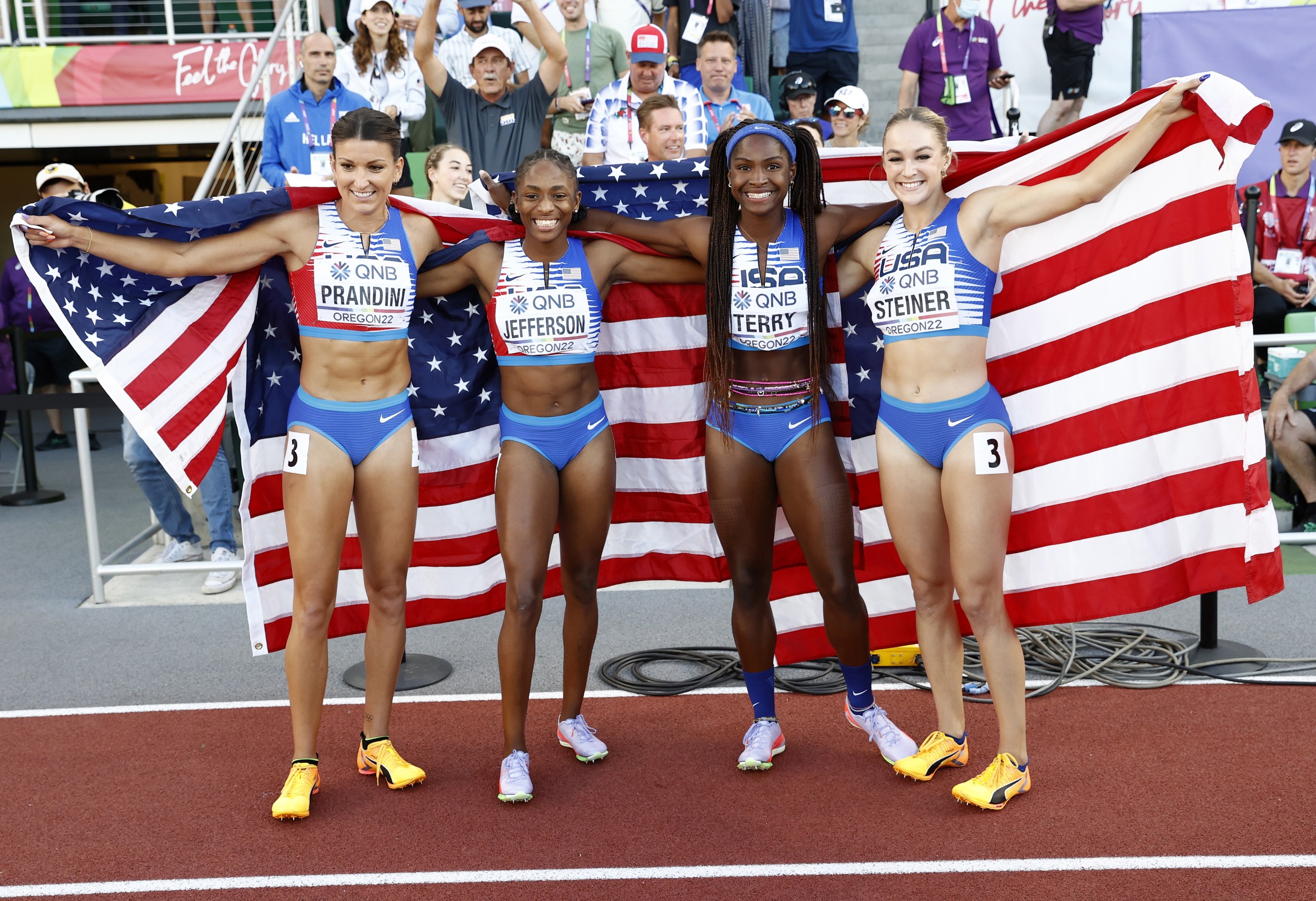 epa10089298 US athletes (L-R) Jenna Prandini, Melissa Jefferson, Twanisha Terry and Abby Steiner of the US celebrate winning the 4x100m relay final Championships Oregon22 at Hayward Field in Eugene, Oregon, USA, 23 July 2022.  EPA/Robert Ghement