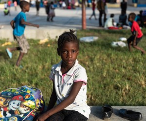 epa10091226 A girl who lived in Cite Soleil and was displaced due to the gang war in her neighborhood is seen in Port-au-Prince, Haiti, 23 July 2022 (issued 25 July 2022). Hundreds of minors have fled from Cite Soleil, a municipality in the metropolitan region of Port-au-Prince, the scene of a bloody war between armed gangs in recent weeks. There the clashes have left more than a hundred dead and thousands of new displaced, according to humanitarian and human rights organizations.  EPA/Johnson Sabin