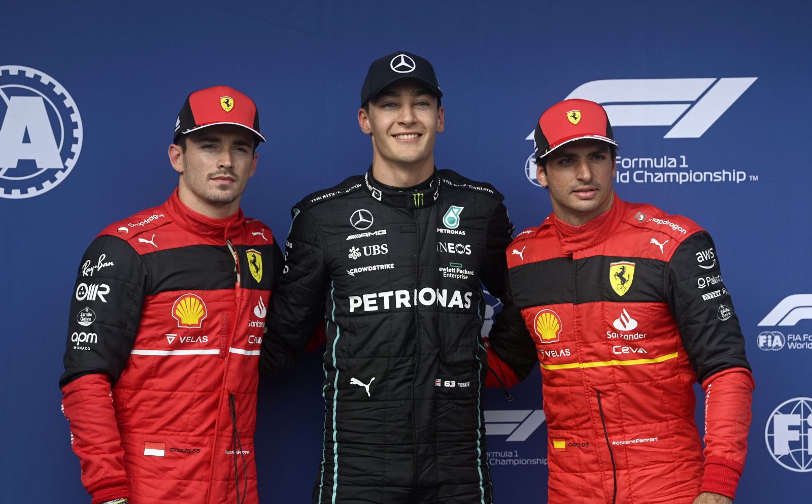epa10098680 British Formula One driver George Russell of Mercedes-AMG Petronas (C) poses after setting a pole position with second placed Spanish Formula One driver Carlos Sainz of Scuderia Ferrari (L) and third placed Ferrari driver Charles Leclerc of Monaco during the qualifying session of the Formula One Grand Prix of Hungary at the Hungaroring circuit in Mogyorod, near Budapest, Hungary, 30 July 2022. The Formula One Grand Prix of Hungary will take place on 31 July 2022.  EPA/Zoltan Balogh HUNGARY OUT