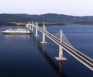 23.06.2022., Komarna - Fotografija iz zraka prolaska prvog velikog kruzera ispod Peljeskog mosta. Photo: Milan Sabic/PIXSELL