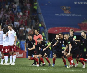 Players of Croatia celebrate after defeating Denmark in the Round of 16 match during the FIFA World Cup 2018 in Nizhny Novgorod, Russia, 1 July 2018. Croatia has come back after conceding in the opening minute to earn a World Cup quarter-final berth, edging Denmark 3-2 in a penalty shootout after the two sides drew 1-1 in the round of 16 match. It could have wrapped up the result five minutes from the end of extra-time, but Luka Modric had his penalty saved by Kasper Schmeichel. However, the Croatia captain returned to bravely take one of the post-match kicks as goalkeeper Danijel Subasic save three of Denmark's efforts to set up a quarter-final meeting with Russia.  (Imaginechina via AP Images)