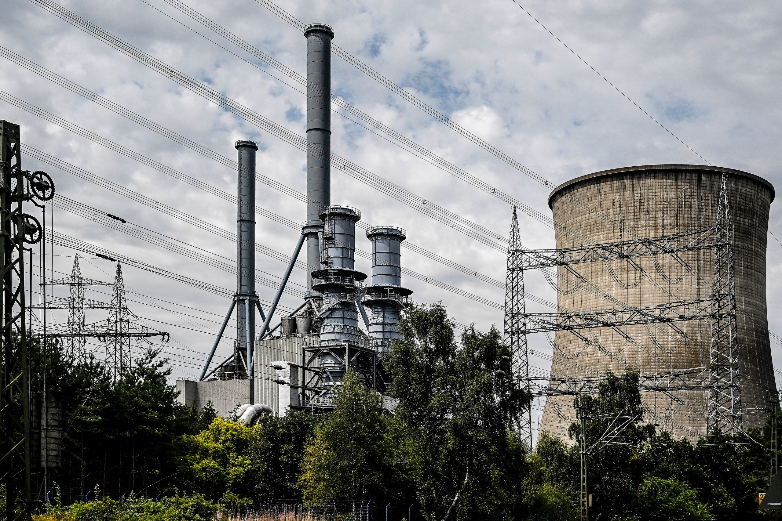epa10091379 The gas power plant operated by German energy supplier RWE is seen near by the Emsland nuclear power plant in Lingen, Germany, 25 July 2022. Politicians are currently discussing whether the operating lives of Germany's last three nuclear power plants, Emsland, Neckarwestheim 2 and Isar 2, should be extended. The three nuclear power plants are to be shut down by 31 December 2022 at the latest, as a nuclear phase-out was decided by the Bundestag in 2011.  EPA/SASCHA STEINBACH