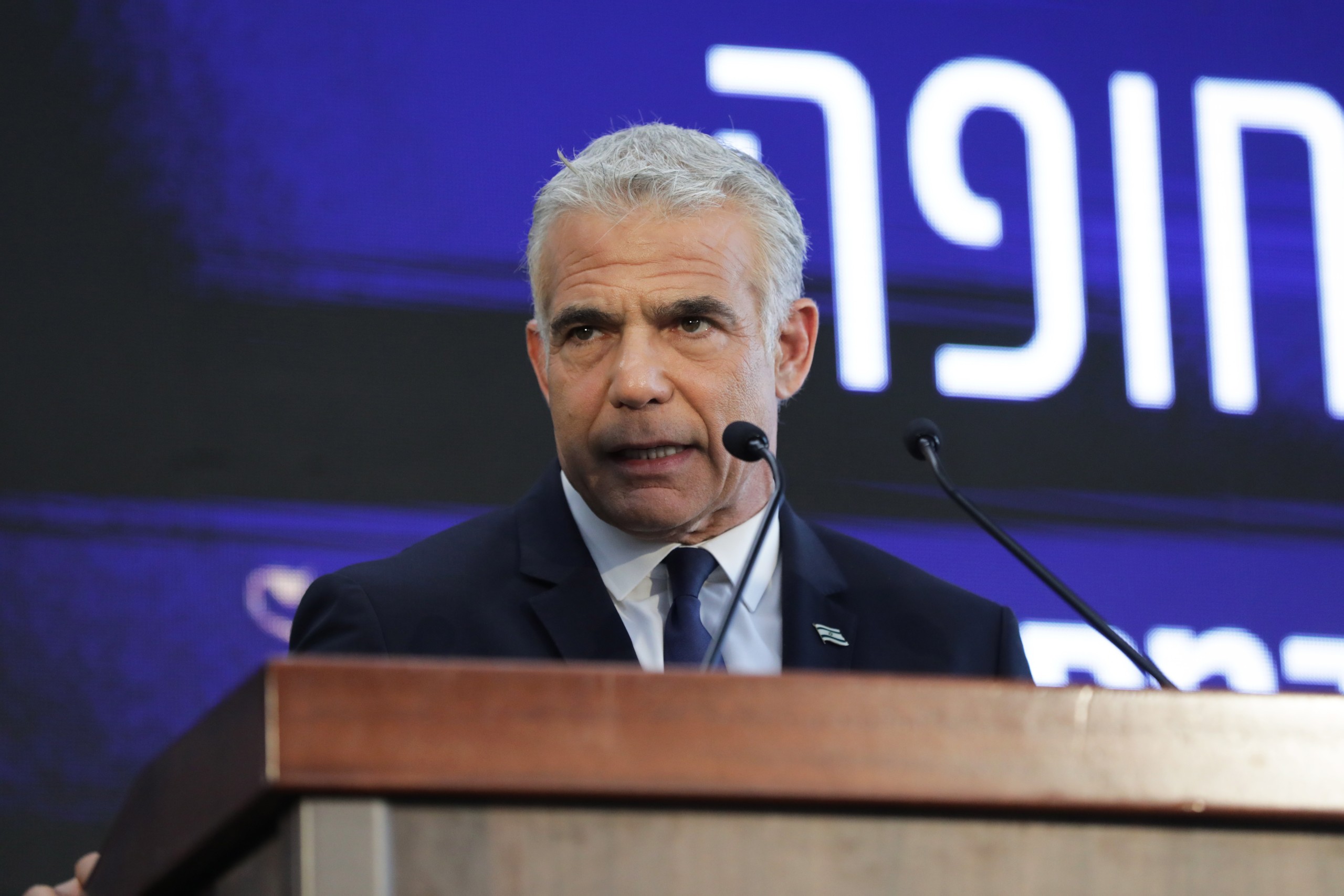 epa10095196 Israeli Prime Minister Yair Lapid speaks during an inauguration ceremony for a new emergency room at the Ichilov Hospital in Tel Aviv, Israel, 28 July 2022.  EPA/ABIR SULTAN