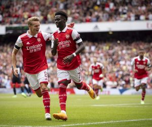 epa10098514 Bukayo Saka of Arsenal (R) celebrates after scoring the first goal of Arsenal during the Emirates Cup soccer match between Arsenal FC and Sevilla FC in London, Britain, 30 July 2022.  EPA/TOLGA AKMEN