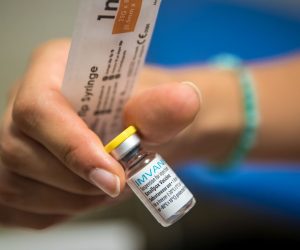 epa10101229 A health worker prepares a dose of Imvanex vaccine used to protect against Monkeypox virus in a refrigerator at the Edison municipal vaccination center in Paris, France, 01 August 2022. Monkeypox is an infectious disease caused by an Orthopoxvirus.  EPA/CHRISTOPHE PETIT TESSON