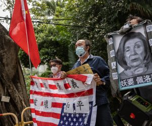 epa10103680 A group of pro-China supporters displays a mock up funeral photo of the US House Speaker Nancy Pelosi and an inverted US flag outside of the US Consulate General in Hong Kong and Macau, in Hong Kong, China, 03 August 2022. The group protested the visit to Taiwan by Nancy Pelosi who is leading a Congressional delegation to the Indo-Pacific region with stops in Singapore, Malaysia, South Korea and Japan.  EPA/JEROME FAVRE
