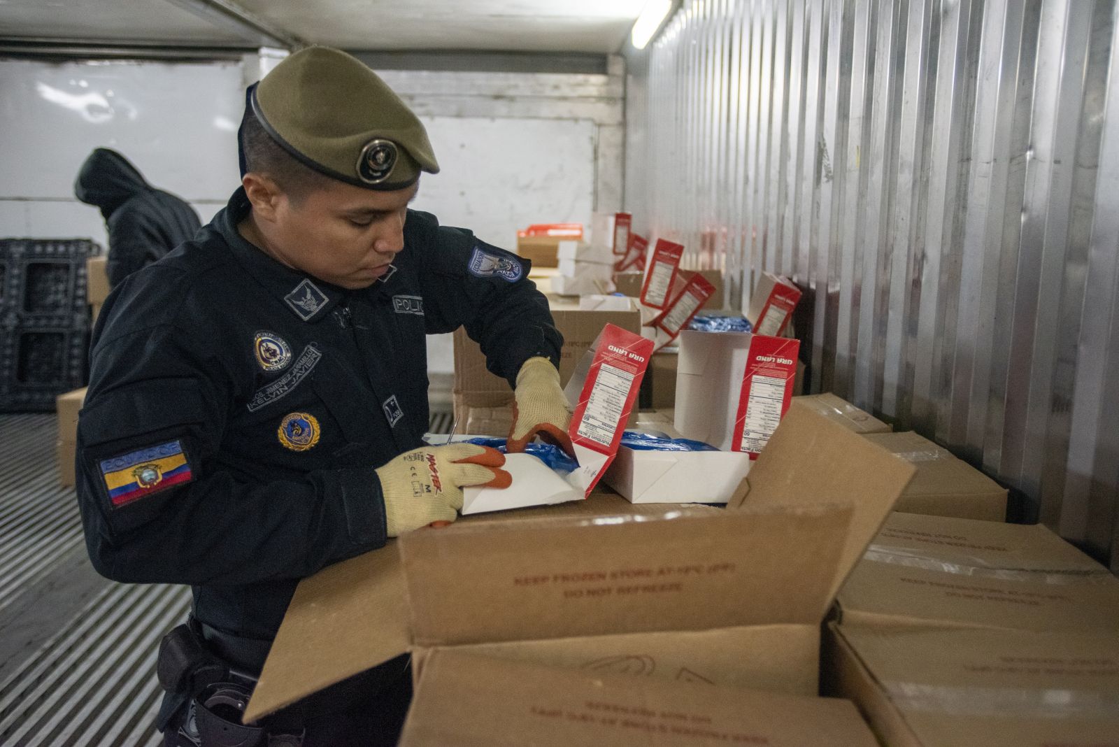epa10104180 Anti-narcotics police search for drugs in several containers, in the Port of Guayaquil, in Guayaquil, Ecuador, 22 July 2022 (Issued 3 August 2022). Through fake fruits, inside wood, between boxes of shrimp, bananas, cereals, scrap, or even in tea bottles, drug trafficking has made the port of Guayaquil in Ecuador one of the great springboards to 'export' tons of cocaine in multiple forms from South America to mainly Europe and the United States.  EPA/Mauricio Torres