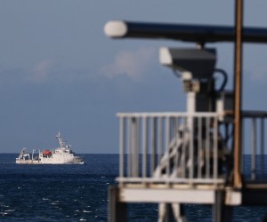 epa10105305 A marine vessel maneuver past a radar tower as it sails away from the location where the Chinese military believed to conduct a live fire drill, is seen from the coast of New Taipei city, Taiwan, 04 August 2022. After the visit of US house Speaker Nancy Pelosi in Taiwan, the Chinese military hold a series of live-fire drills in six maritime areas near Taiwan from 04 - 07 August 2022.  EPA/RITCHIE B. TONGO