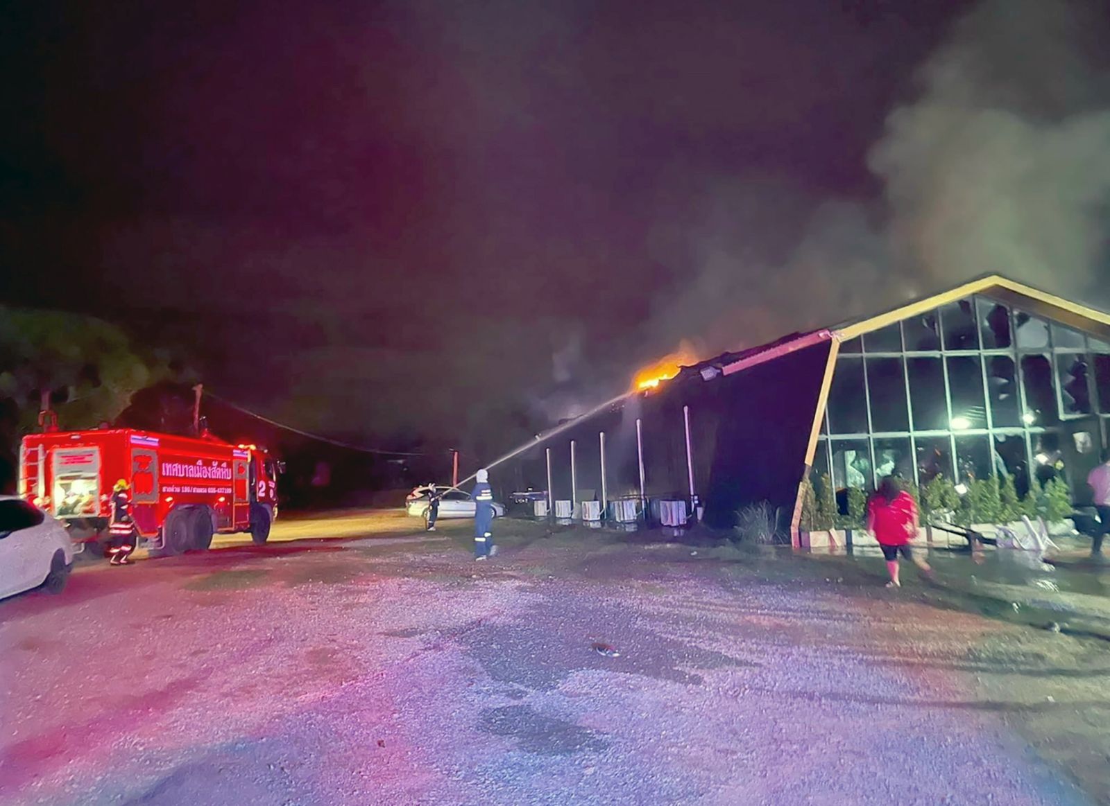 epa10106761 A handout photo released by the Sawang Rojana Thammasathan rescue foundation shows rescue workers and firefighters extinguishing a fire at the Mountain B nightclub in Sattahip district, Chonburi province, Thailand, early 05 August 2022. A fire broke out at a crowded nightclub in the early hours of 05 August 2022, killing at least 13 people and injuring some 40 others, according to the Sawang Rojana Thammasathan rescue foundation.  EPA/SAWANG ROJANA THAMMASATHAN RESCUE FOUNDATION HANDOUT -- BEST QUALITY AVAILABLE -- HANDOUT EDITORIAL USE ONLY/NO SALES