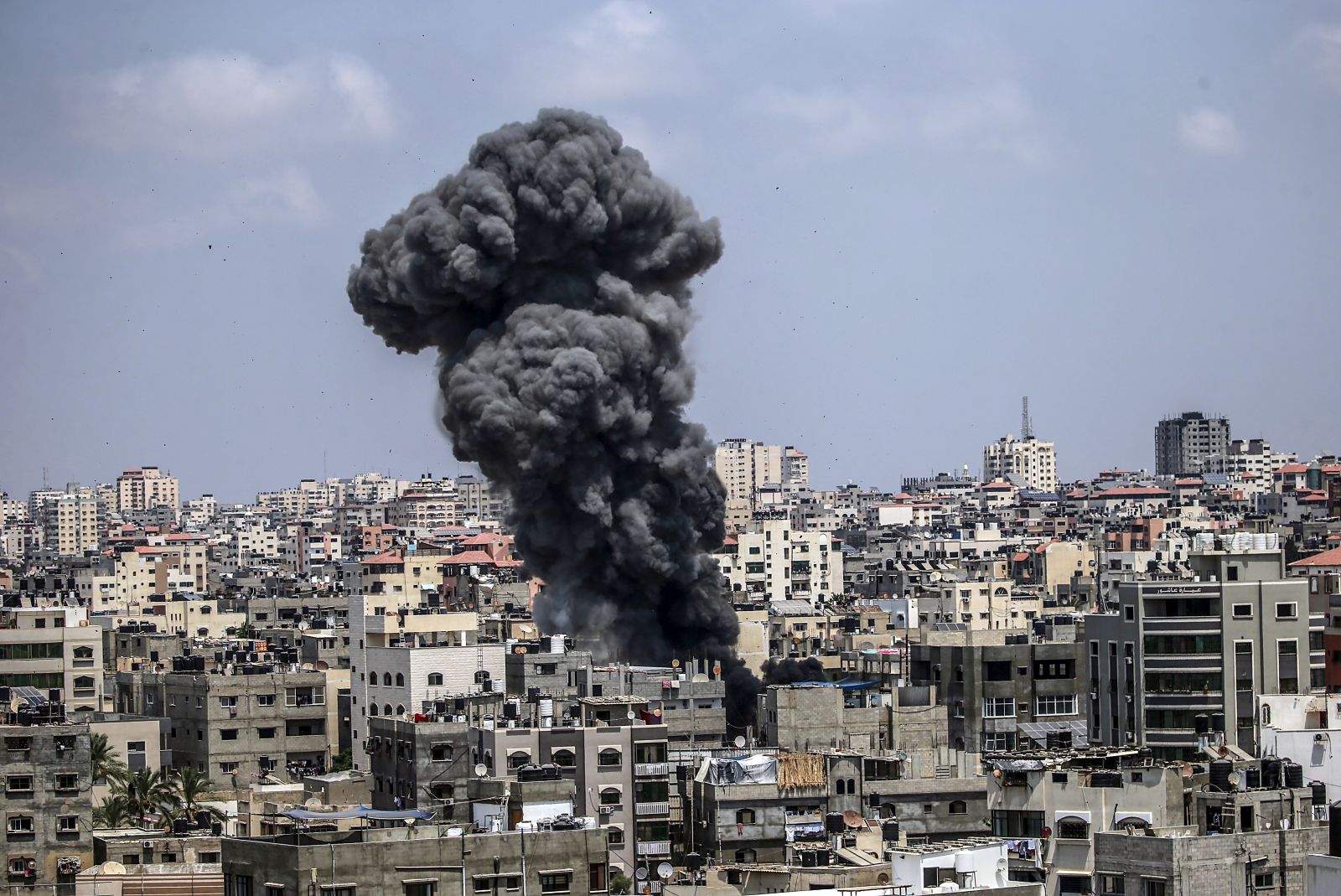 epa10108486 Smoke rises after an Israeli air strike in Gaza City, 06 August 2022. According to the Palestinian ministry of health, at least ten people were killed, including a child, in a series of Israeli airstrikes on multiple targets in the Gaza Strip including a residential apartment in neighborhood of Al-Rimal. Al-Quds Brigades, the armed wing of the Palestinian Islamic Jihad, announced that senior leader Tayseer al-Jabari was killed in the attacks.  EPA/HAITHAM IMAD