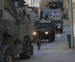 epa10111103 Israeli soldiers take part in a raiding operation in Rummana village near the West Bank city of Jenin, 08 August 2022. Israeli troops raided Rummana village and demolished two houses that belonged to Palestinians Subhi Hamdan and Asad Rifae who allegedly carried attacks at Elad city near Tel Aviv on May 2022 killing three Israelis.  EPA/ALAA BADARNEH