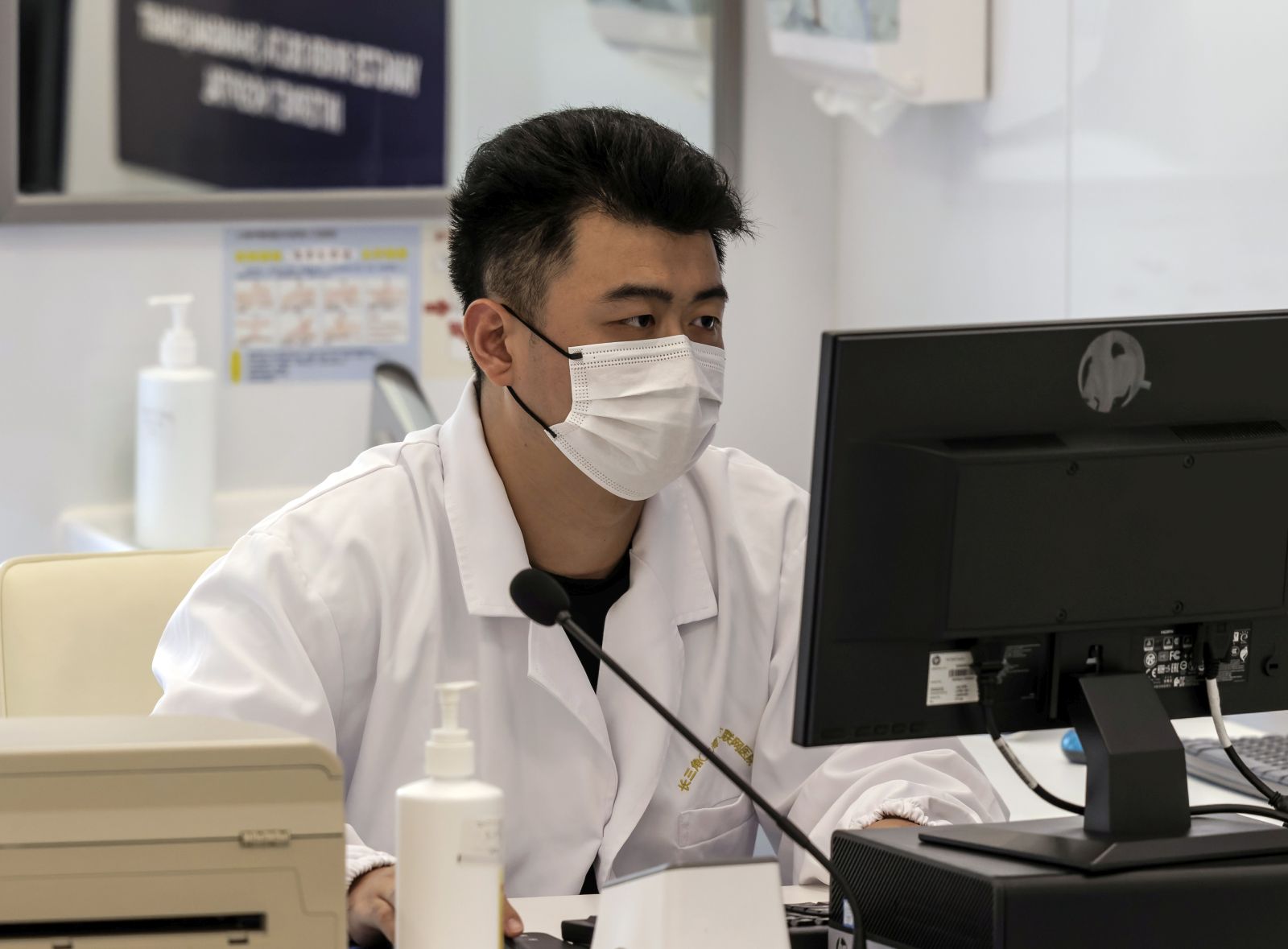 epa10112410 A doctor talks with a patient online during the organised press tour of the Yangtze River Delta (Shanghai) Smart Internet Hospital, in Shanghai, China, 09 August 2022. Yangtze River Delta (Shanghai) Smart Internet Hospital is the model for the future construction of the digital health city in Qingpu district, Shanghai. Intelligent consultation rooms, QR codes for the electronic medical insurance cards, and smart medical treatment navigations are just a few features that management of the hospital refers to their institutions as the “Hospital of the future”.  EPA/ALEX PLAVEVSKI