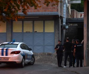 epa10117916 Police officers close off the crime scene at Cetinje, Montenegro, 12 August 2022. A 34 year old male in Montenegro went on a shooting rampage after a family dispute, killing at least 10 people on the street before being gunned down in an exchange of fire with the police.  EPA/BORIS PEJOVIC