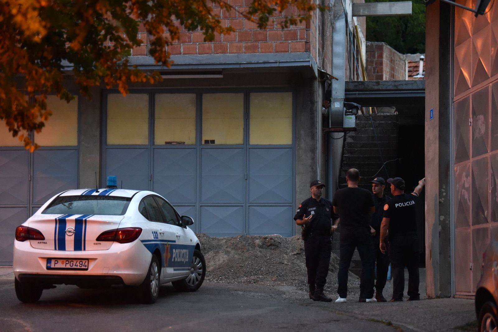 epa10117916 Police officers close off the crime scene at Cetinje, Montenegro, 12 August 2022. A 34 year old male in Montenegro went on a shooting rampage after a family dispute, killing at least 10 people on the street before being gunned down in an exchange of fire with the police.  EPA/BORIS PEJOVIC