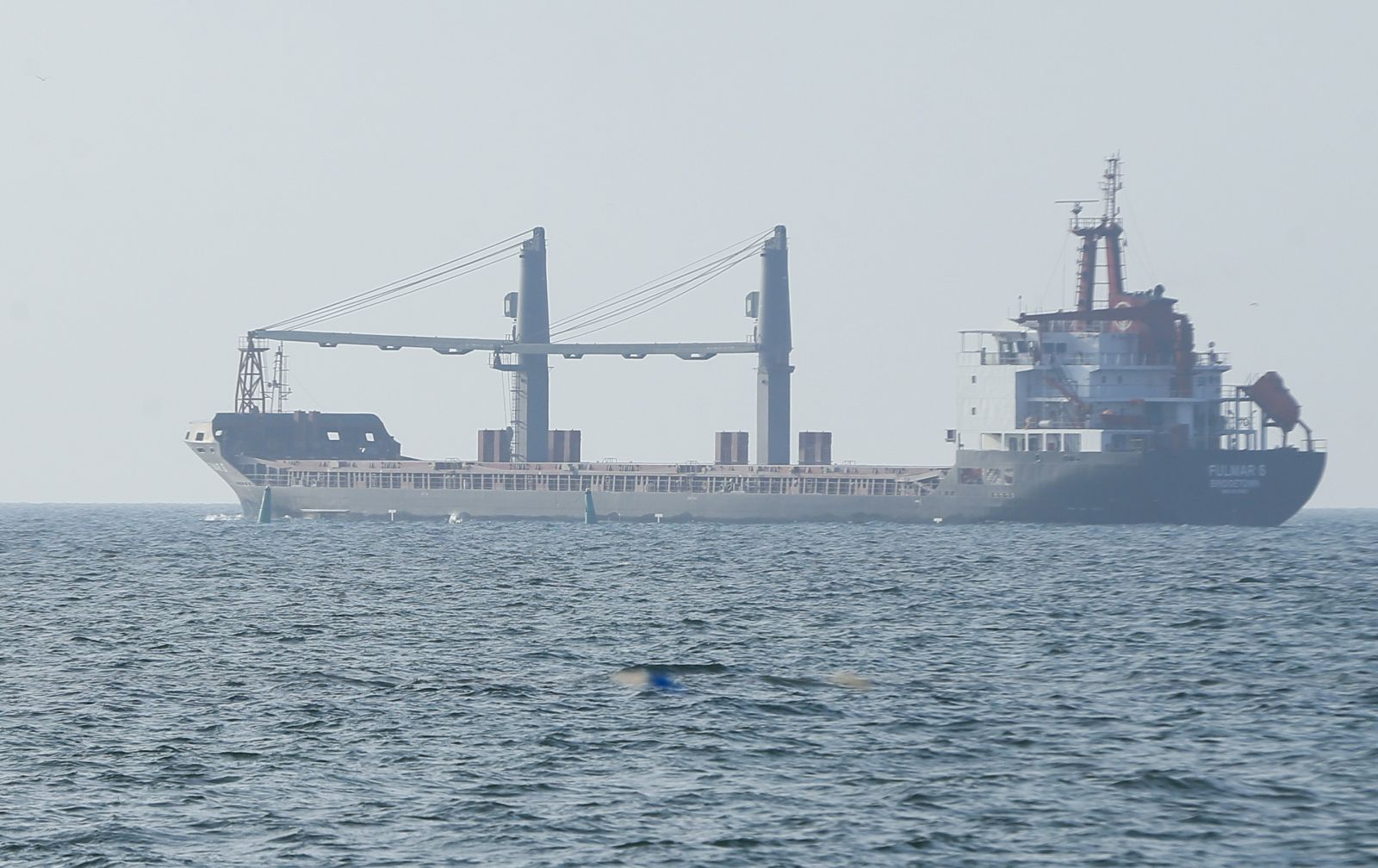 epa10118529 The FULMAR S bulker leaves a port near South Ukrainian city of Odesa, Ukraine, 13 August 2022. FULMAR S was the first ship to enter a Ukrainian port since the start of Russian invasion. The bulker FULMAR S, under the Barbados flag, left the port of Chornomorsk of Odesa area in the direction of Turkey. It will team up in a caravan with the THOE bulker and together they will carry 14.5 thousand tons of agricultural products, according to the Ukrainian Ministry of Infrastructure. Ukraine exports grain since a safe passage deal was signed between Ukraine and Russia on 22 July in Istanbul.  EPA/STR