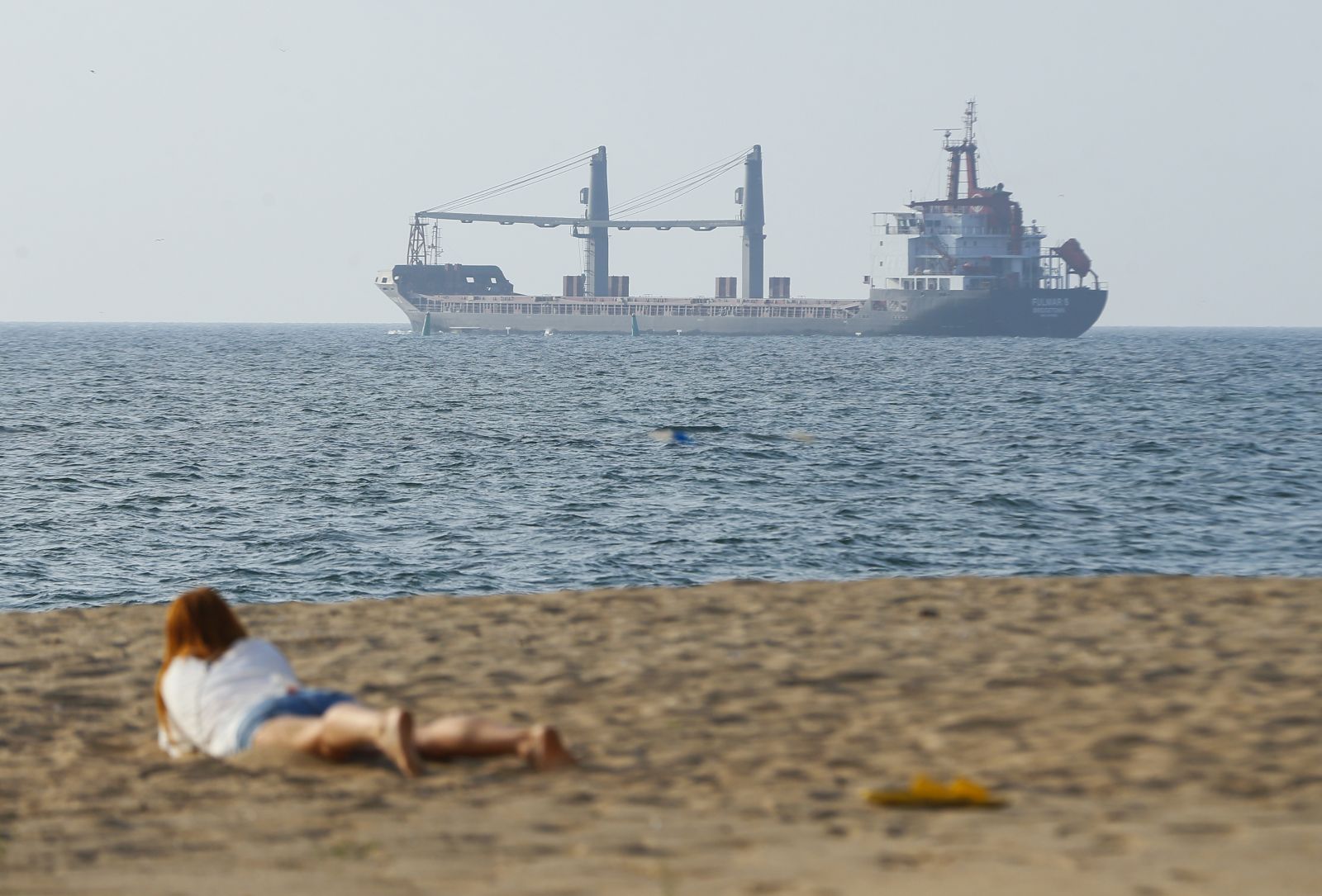 epa10118529 The FULMAR S bulker leaves a port near South Ukrainian city of Odesa, Ukraine, 13 August 2022. FULMAR S was the first ship to enter a Ukrainian port since the start of Russian invasion. The bulker FULMAR S, under the Barbados flag, left the port of Chornomorsk of Odesa area in the direction of Turkey. It will team up in a caravan with the THOE bulker and together they will carry 14.5 thousand tons of agricultural products, according to the Ukrainian Ministry of Infrastructure. Ukraine exports grain since a safe passage deal was signed between Ukraine and Russia on 22 July in Istanbul.  EPA/STR