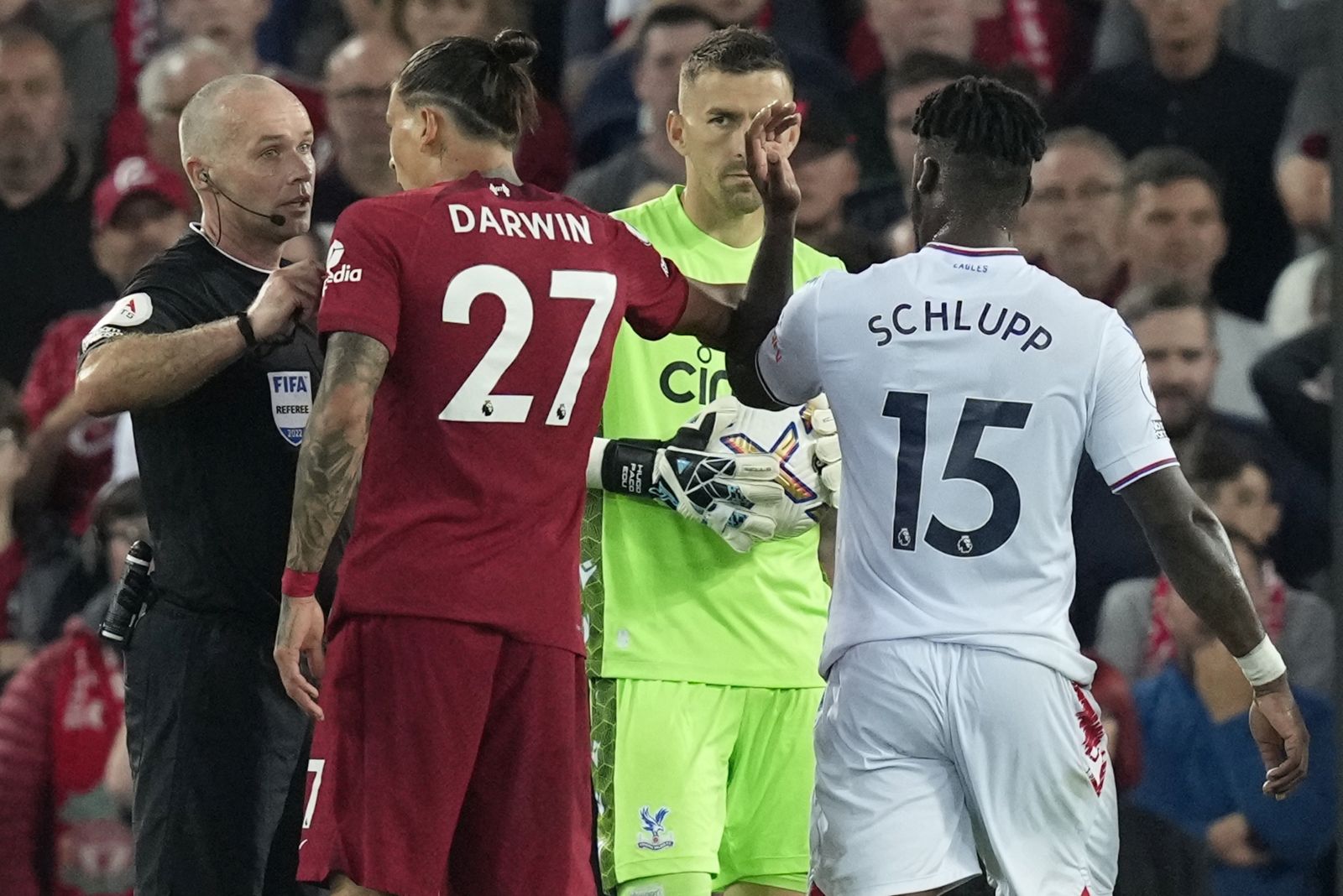 epa10123252 Referee Paul Tierney (L) talks to Liverpool's Darwin Nunez (C) during the English Premier League soccer match between Liverpool FC and Crystal Palace in Liverpool, Britain, 15 August 2022.  EPA/ANDREW YATES EDITORIAL USE ONLY. No use with unauthorized audio, video, data, fixture lists, club/league logos or 'live' services. Online in-match use limited to 120 images, no video emulation. No use in betting, games or single club/league/player publications