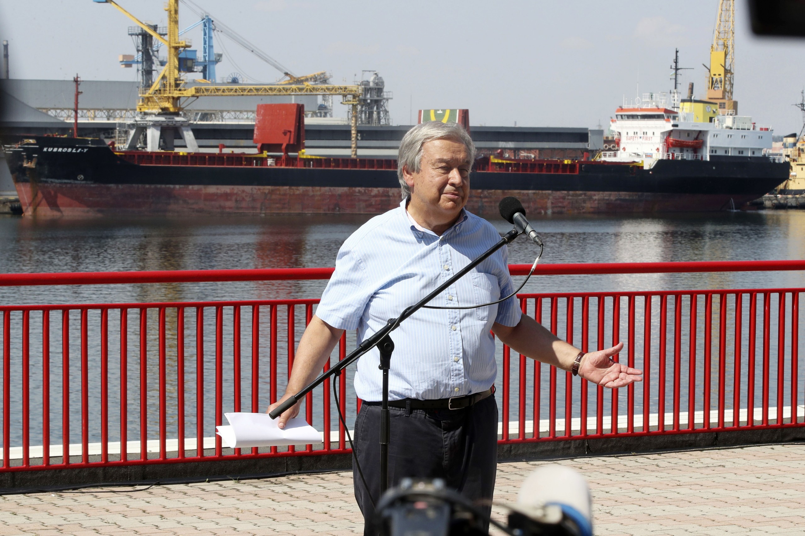 epa10128901 UN Secretary-General Antonio Guterres speaks to journalists at the end of his visit to the Odesa grain port, where in the background Comoros-flagged cargo vessel Kubrosli Y moors, in Odesa, Ukraine, 19 August 2022. Guterres arrived in Ukraine the previous dayto meet with President Zelensky and Turkish President Erdogan to talk on improving the grain initiative and the situation around the Zaporizhzhia nuclear power plant. The port of Odesa is being used for the export of Ukrainian grain through the Ukraine-Russia agreement promoted by the UN and Turkey. Russian troops on 24 February entered Ukrainian territory, starting a conflict that has provoked destruction and a humanitarian crisis.  EPA/MANUEL DE ALMEIDA