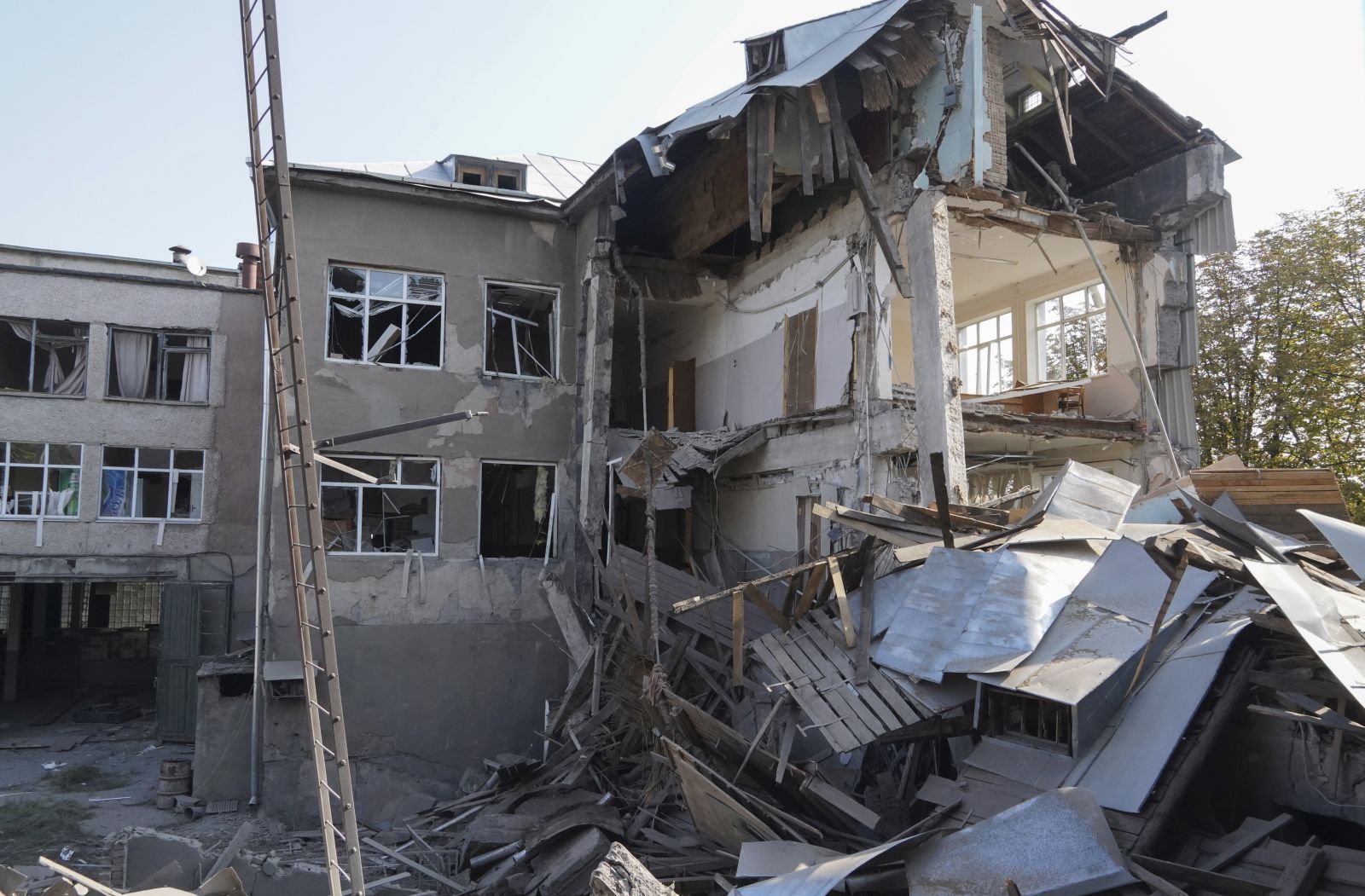 epa10129109 The site of the shelling of one of the educational institutions in Kharkiv, Ukraine, 19 August 2022 after about five rockets were launched from the Russian city of Belgorod amid Russia's military invasion. At least one woman was killed during the attack, the chairman of the Kharkiv Regional State Administration Oleg Sinegubov said. Kharkiv and surrounding areas have been the target of heavy shelling since February 2022, when Russian troops entered Ukraine starting a conflict that has provoked destruction and a humanitarian crisis.  EPA/VASILIY ZHLOBSKY