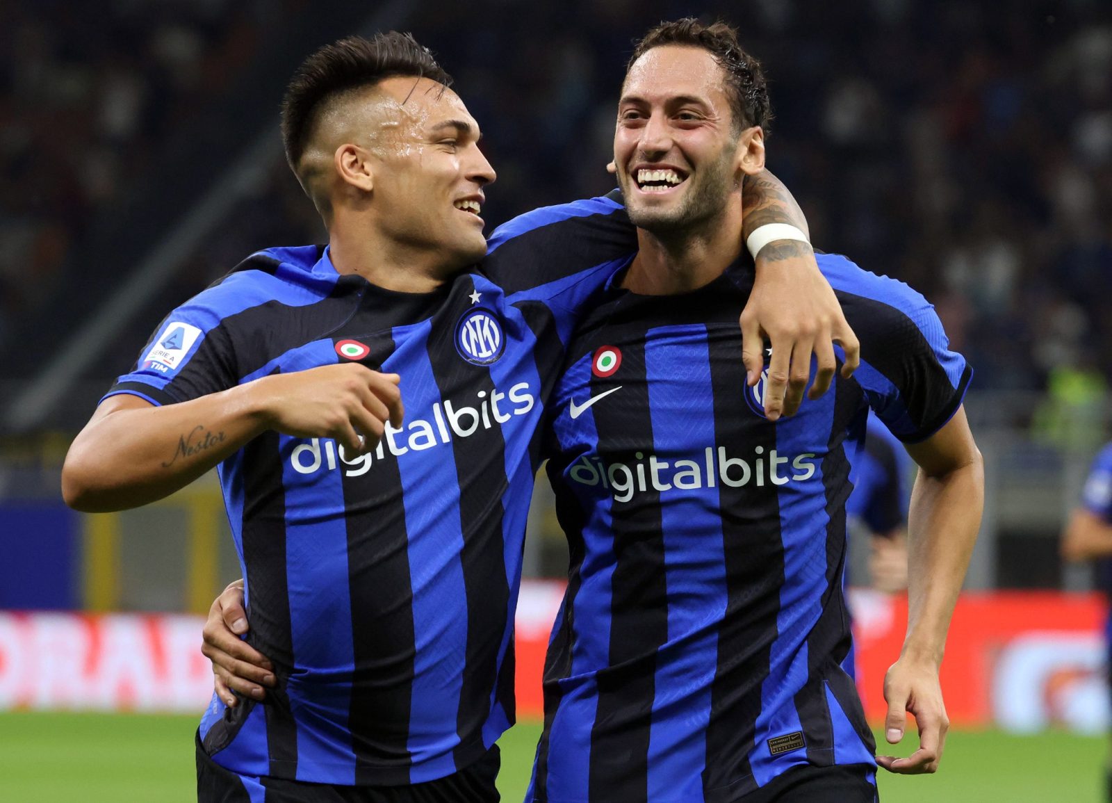 epa10131029 Inter Milan’s Hakan Calhanoglu (R) jubilates with his teammate Lautaro Martinez after scoring during the Italian serie A soccer match between FC Inter and Spezia at Giuseppe Meazza stadium in Milan, Italy, 20 August 2022.  EPA/MATTEO BAZZI