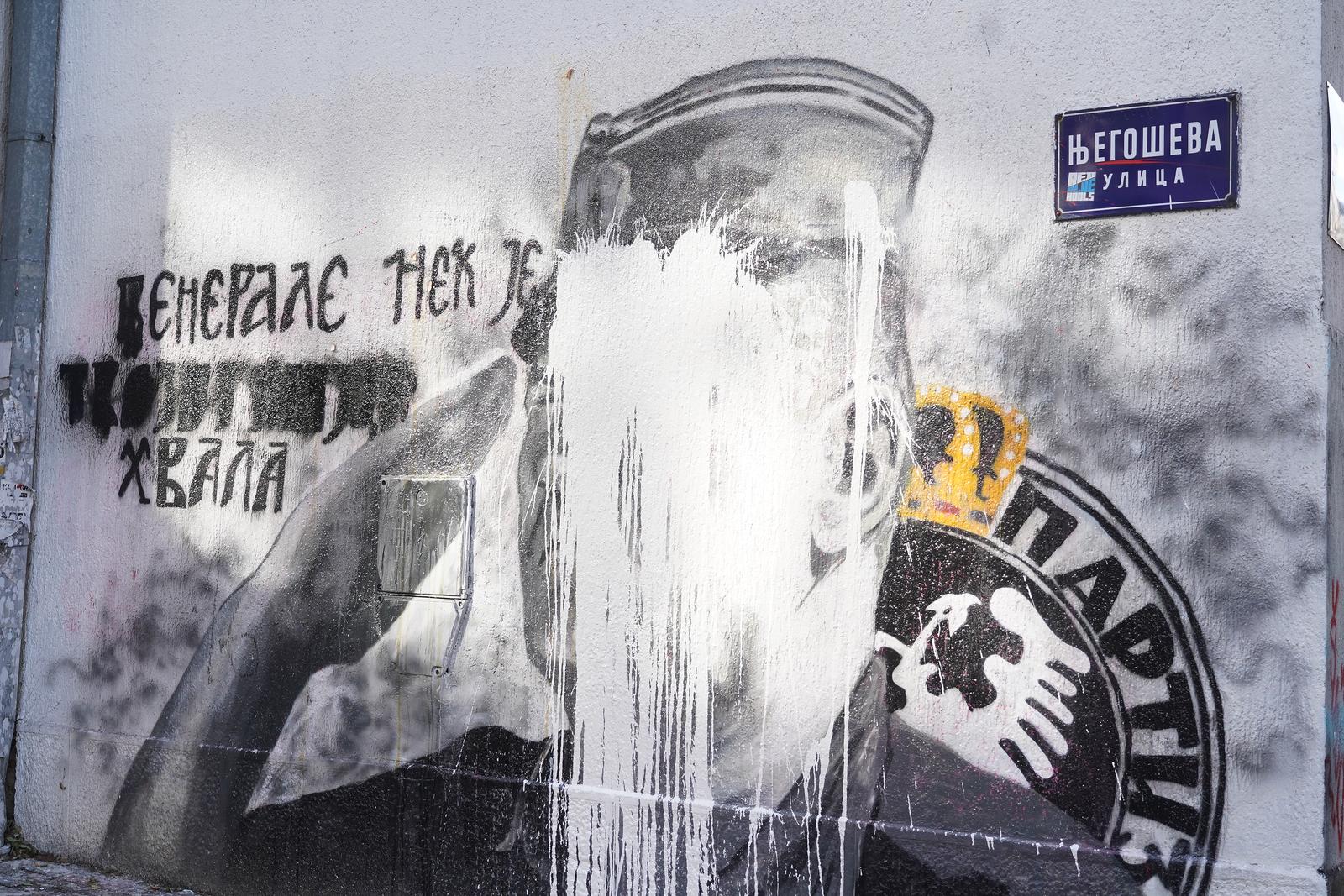 10, November, 2021, Belgrade - A bucket of lime was thrown on the mural with the image of Ratko Mladic, and behind it stands Djordjo Zujovic, a longtime activist and member of the Social Democratic Party of Serbia.   10, novembar, 2021, Beograd  - Na mural sa likom Ratka Mladica bacena je kofa kreca, a iza toga stoji Djordjo Zujovic, dugogodisnji aktivista i clan Socijaldemokratske partije Srbije.  Photo: Antonio Ahel/PIXSELL